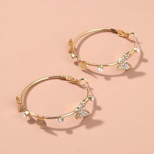 Butterfly hoops, gold plated and diamond.